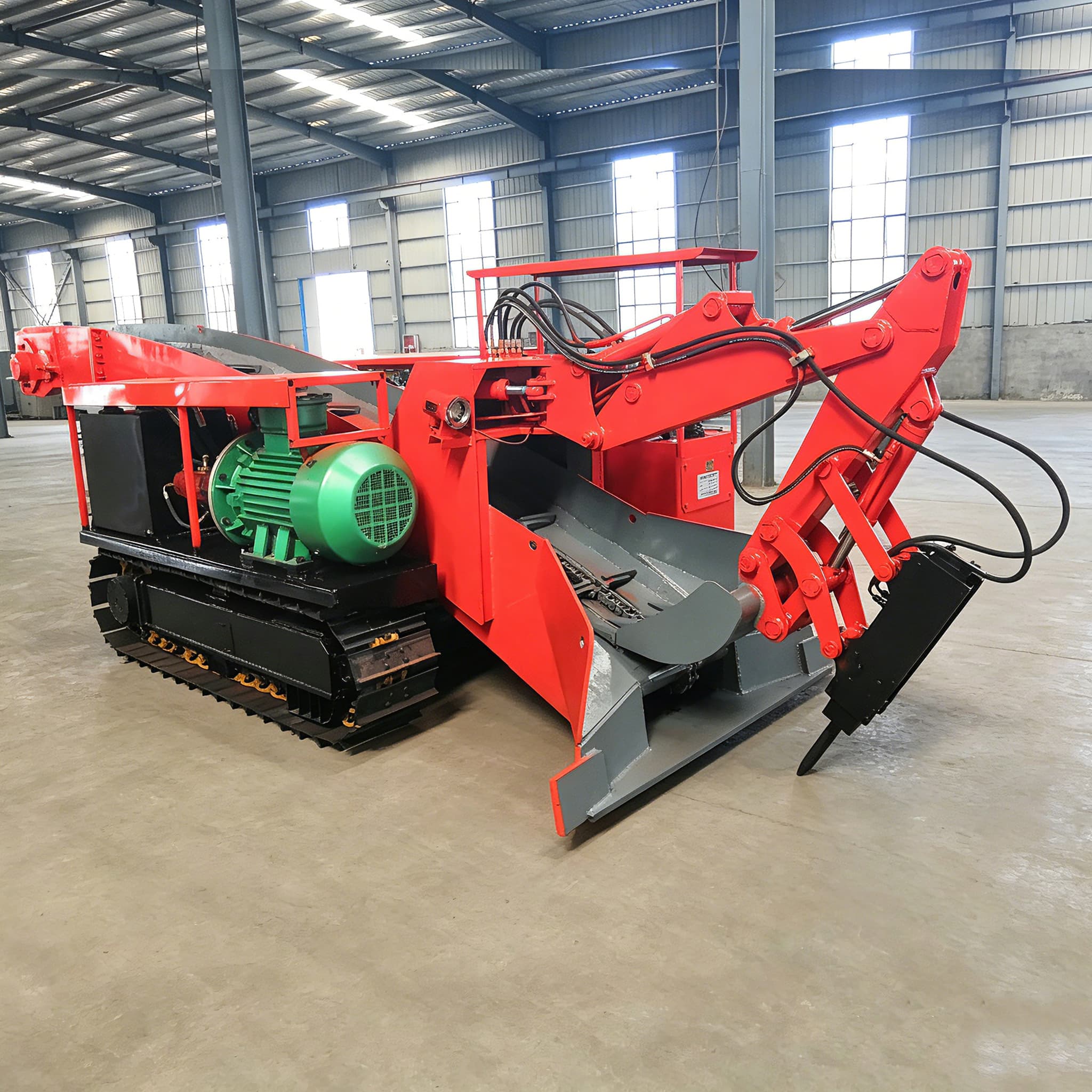 Tracked mucking loader used for travel-system selection